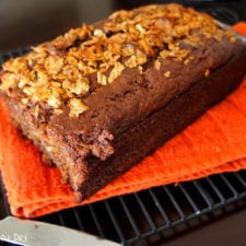 A loaf of Banana Nutella Crunch Bread on a cooling rack