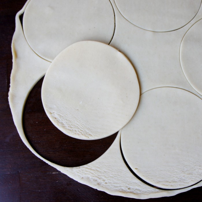 Raw pie crust cut into small round circles