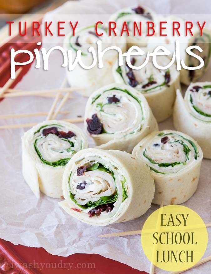 These Turkey Cranberry Pinwheels are filled with a creamy cream cheese, spinach, turkey and cranberries! Perfect for lunch or appetizers!