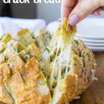 This Cheesy Pesto Crack Bread is a super quick and easy appetizer that everyone will go nuts for!
