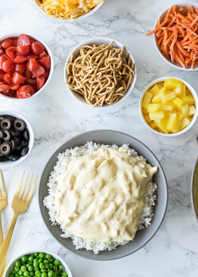 These Quick and Easy Hawaiian Haystacks start out with a super simple chicken gravy, that's poured over a bed of rice, then topped with all your favorite toppings. 