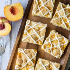 Food on a table with squares of pie bars