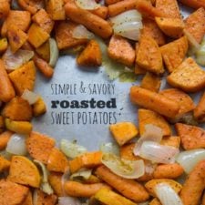 A pan of roasted sweet potatoes, carrots and onions
