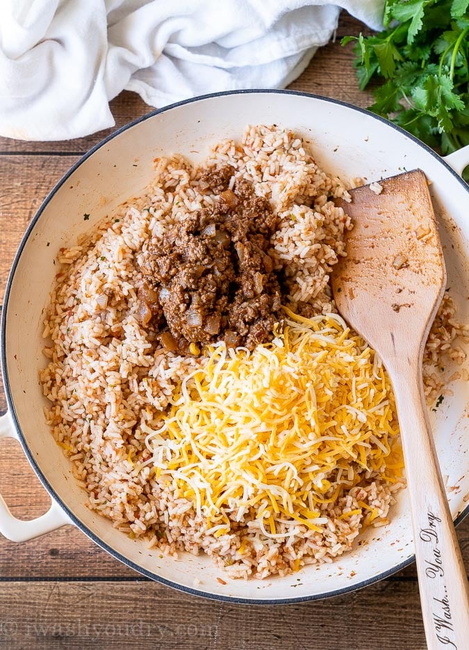 Quick Spanish Rice with cheese and taco meat on top.