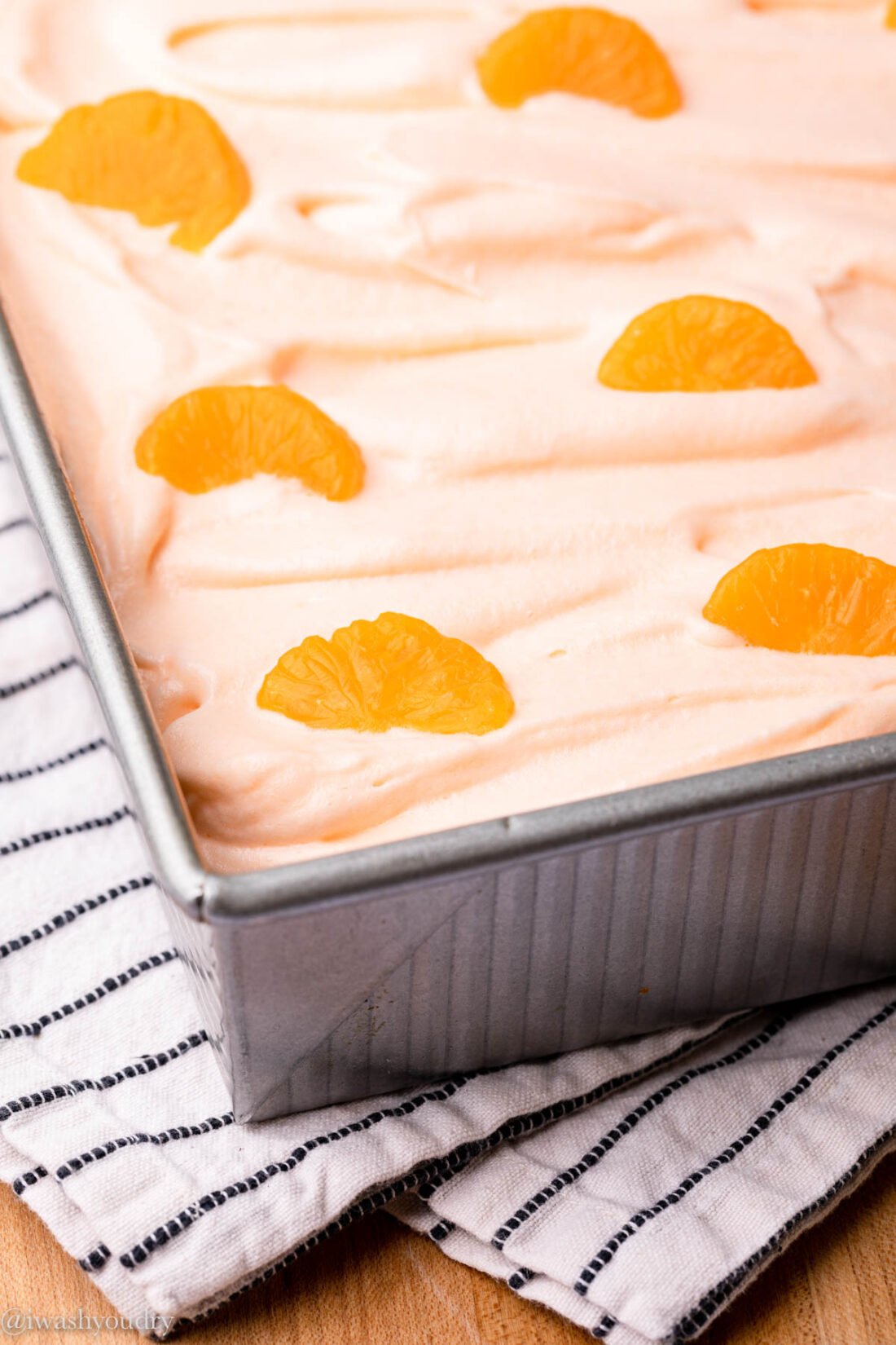 decorated orange cake with orange slices on top 