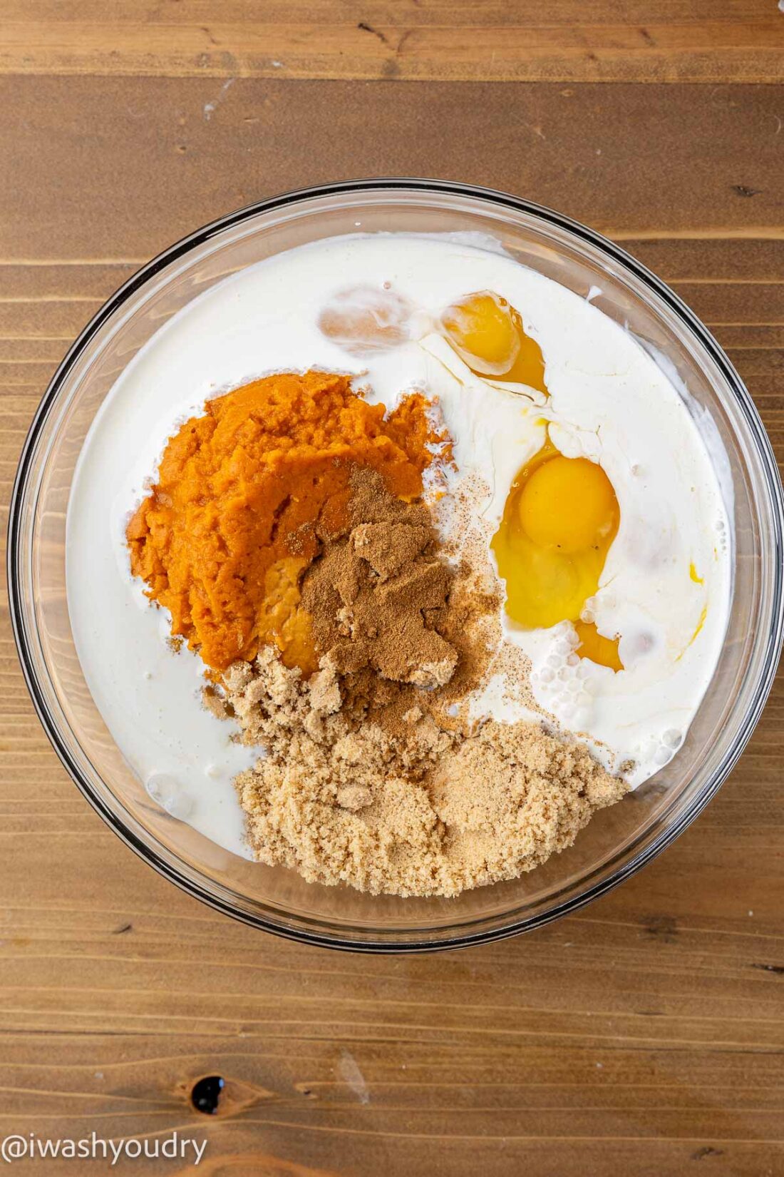 Ingredients for pumpkin filling in a glass bowl.