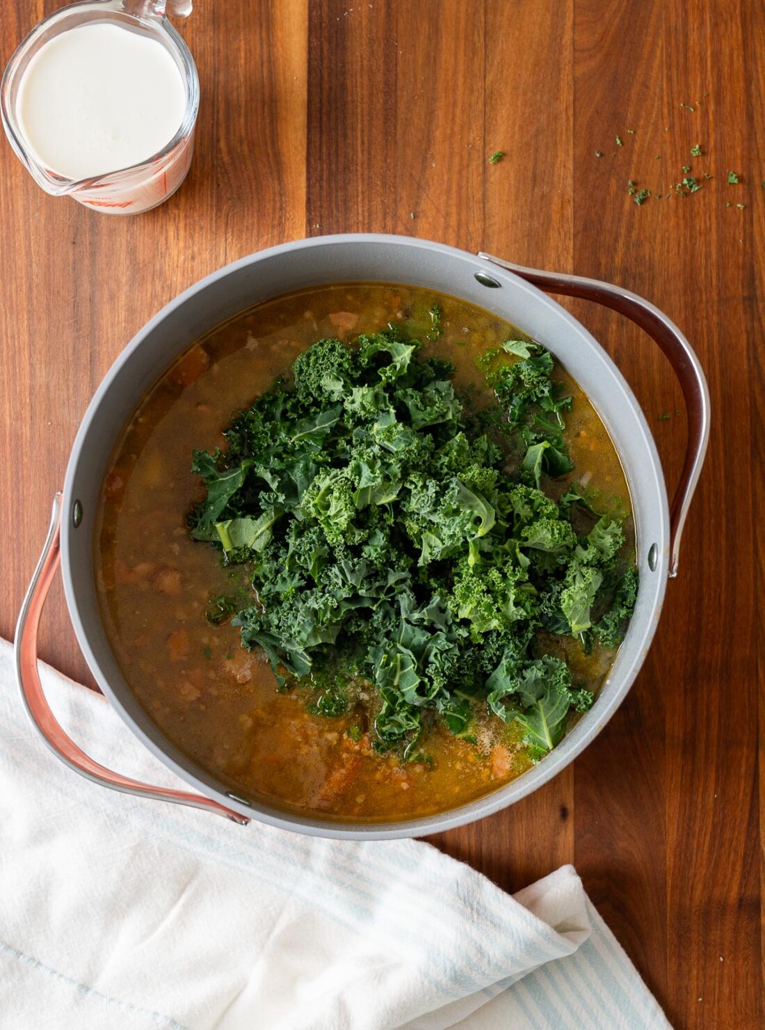 Raw kale on top of zuppa toscana.